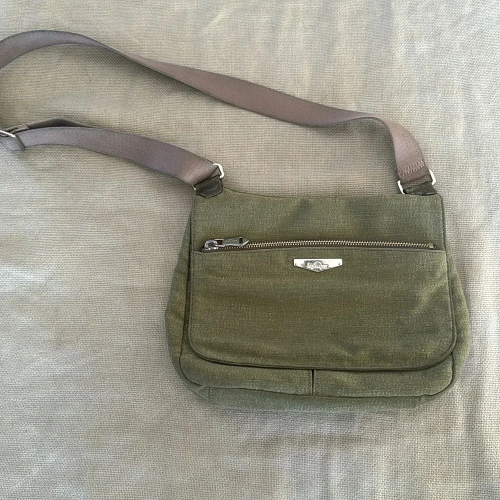 Kipling moss green with colbalt blue lining crossbody bag